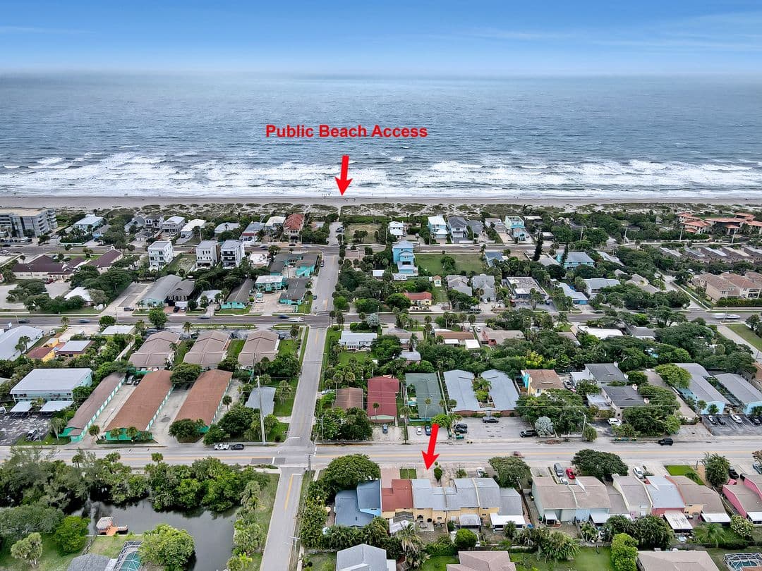 Aerial view of the neighborhood showing the property location and public beach access just two blocks away