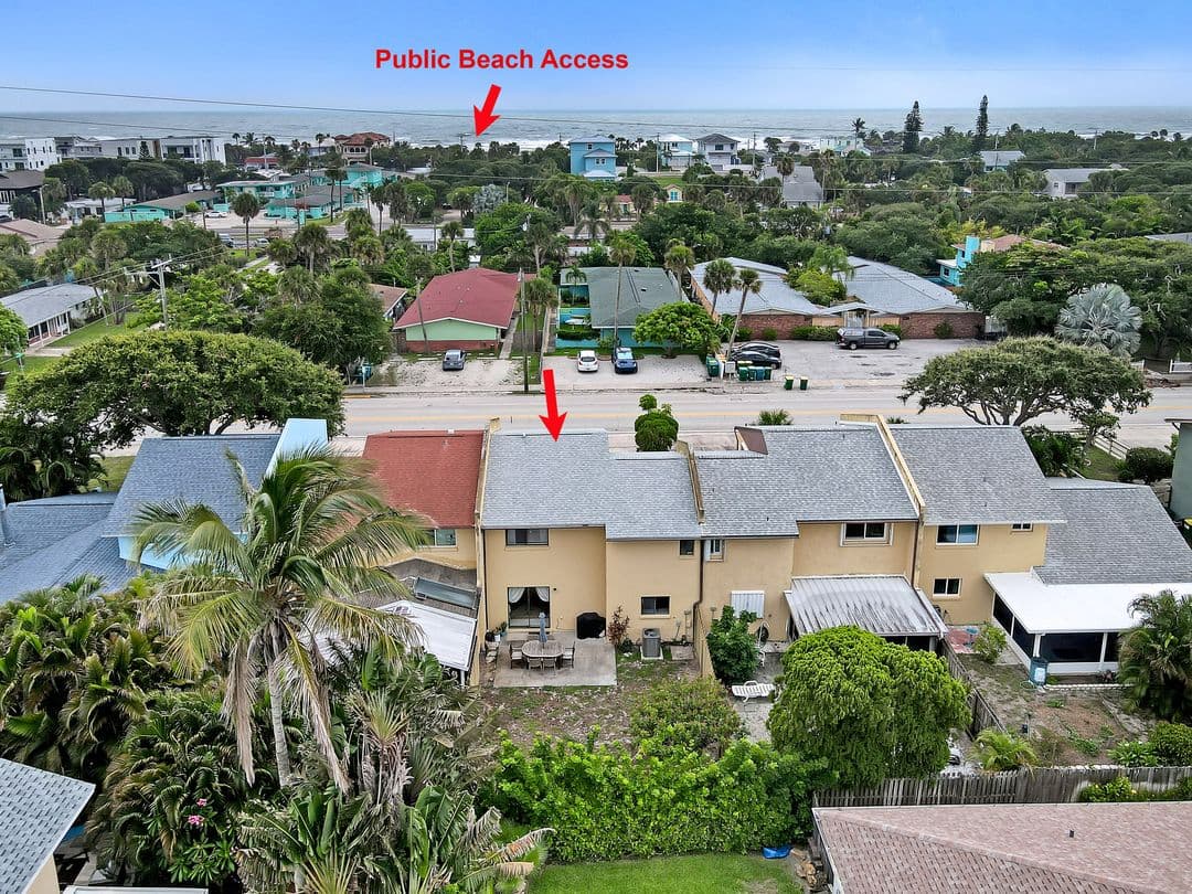 Closer aerial view of Martha Villas townhome with ocean and beach visible in the background